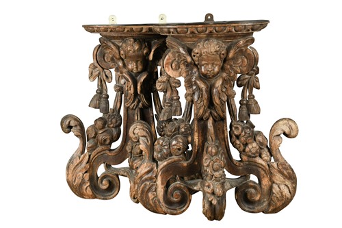 Lot 454 - A pair of 17th century carved limewood wall brackets