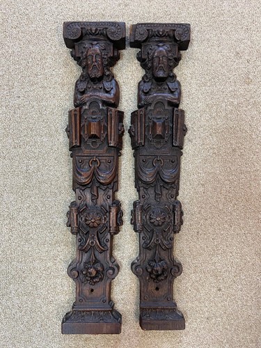Lot 469 - Two similar carved oak herms