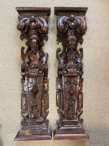 Lot 494 - A near pair of oak carved herms, probably 17th century