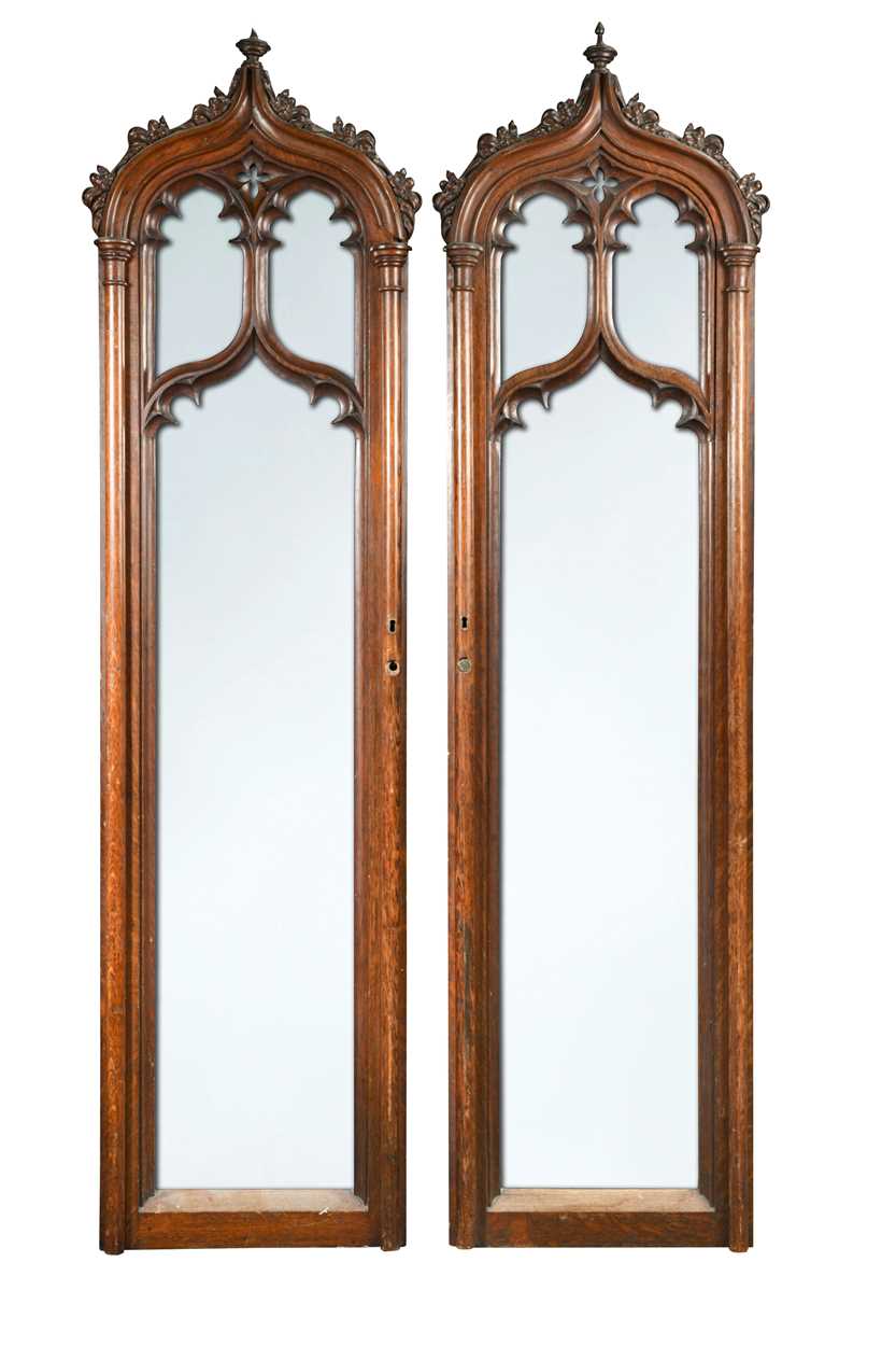 Lot 594 - A pair of carved oak Gothic revivial arched door panels
