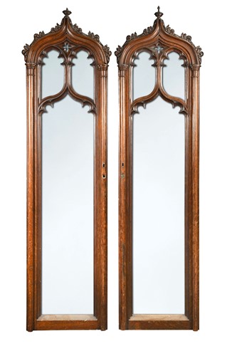 Lot 594 - A pair of carved oak Gothic revivial arched door panels