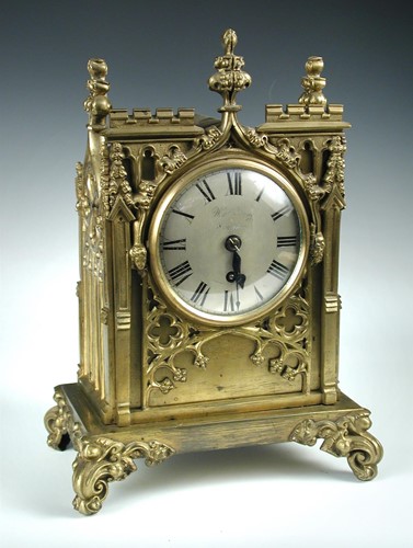 Lot 426 - A 19th century 'gothic' case lacquered brass mantle timepiece