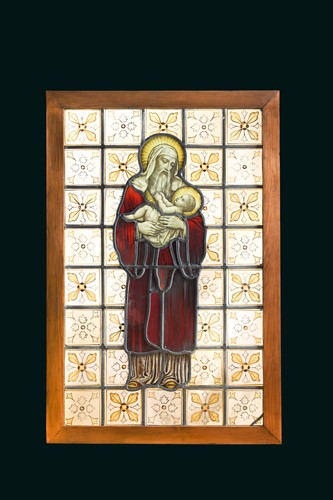 Lot 405 - A 19th century stained glass panel of a male saint holding the infant Jesus