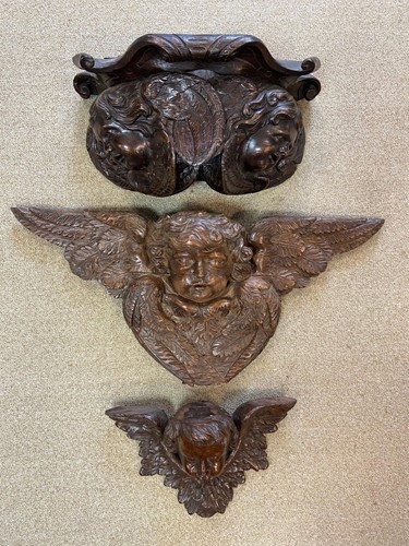 Lot 478 - Two carved cherubic wall brackets, late 17th or early 18th century
