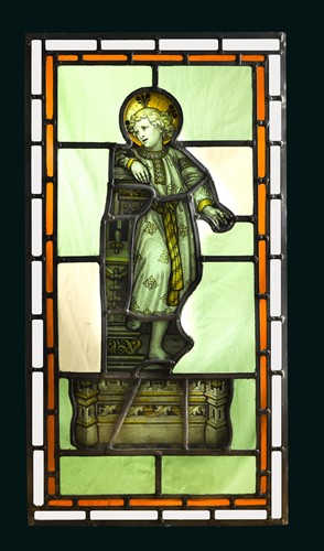 Lot 397 - An 18th century stained glass panel of a young boy with halo