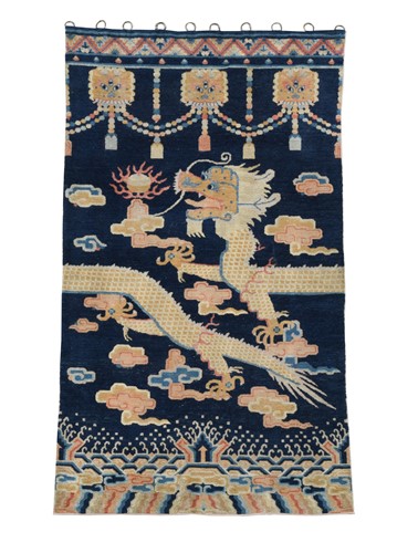 Lot 511 - A Tibetan wool rug/hanging, 20th century