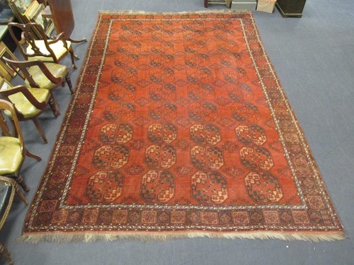 Lot 545 - An Ersari red ground carpet