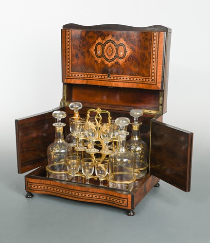 Lot 380 - A 19th century inlaid table top liquor cabinet with key