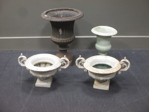 Lot 570 - Four cast iron planters including a pair of...