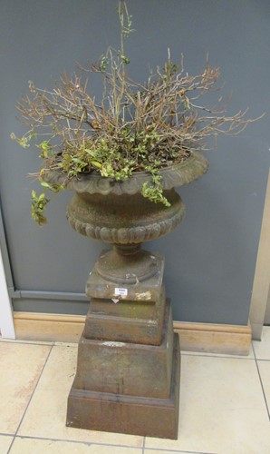 Lot 564 - A 19th century cast iron urn, 97cm high
