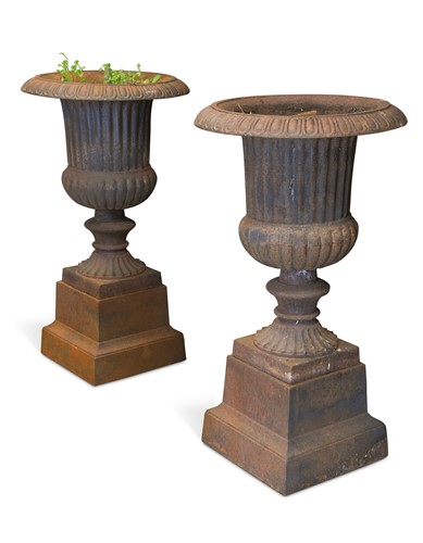 Lot 639 - A pair of cast iron Campana style urns