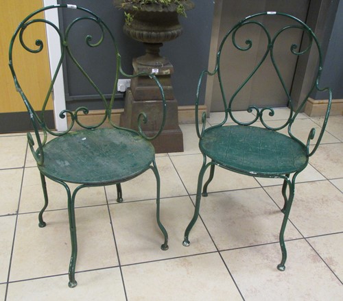 Lot 561 - A pair of painted metal garden chairs