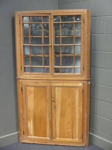 Lot 348 - A 19th century pine corner cupboard with...