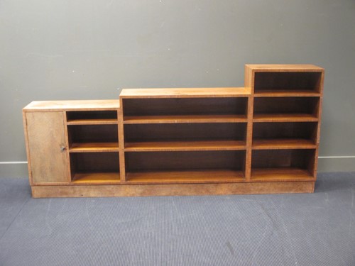 Lot 360 - An Art Deco walnut stepped bookcase together...