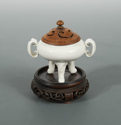 Lot 62 - A Chinese Dehua-type tripod censer, Qing Dynasty