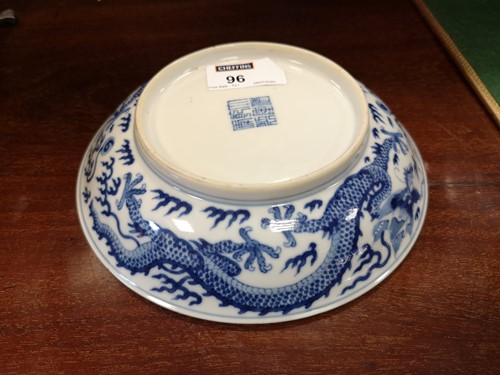 Lot 96 - A Chinese blue and white porcelain dragon dish, Qianlong (1736-1795)