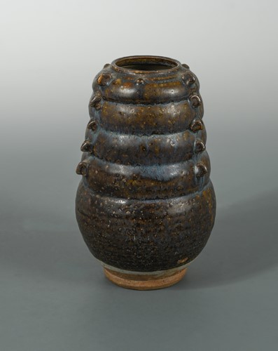 Lot 59 - A Chinese brown phosphatic glazed pottery jar, Tang Dynasty style