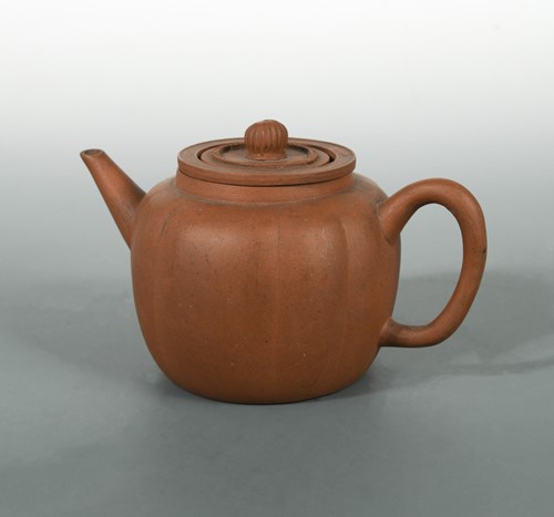 Lot 63 - A Chinese Yixing melon shape teapot, cover, and internal strainer, late Qing Dynasty