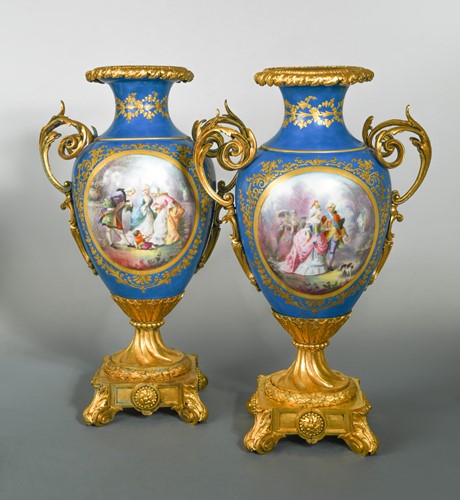 Lot 42 - A pair of French porcelain, two-handled ormolu mounted vases, probably Sevres
