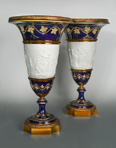 Lot 47 - A pair of Sévres porcelain and metal mounted pedestal vases