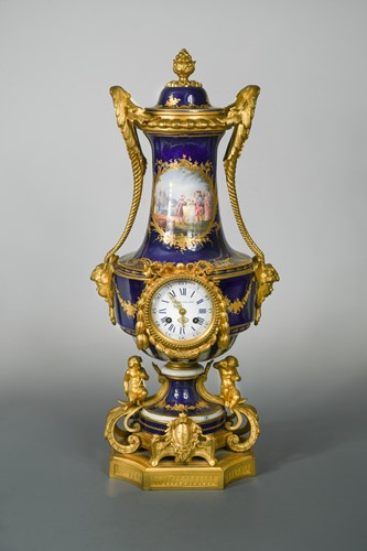 Lot 46 - A 19th century French porcelain and ormolu mounted vase-shape clock and cover, probably Sevres