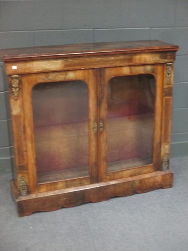 Lot 508 - A Victorian walnut two-door glazed cabinet,...