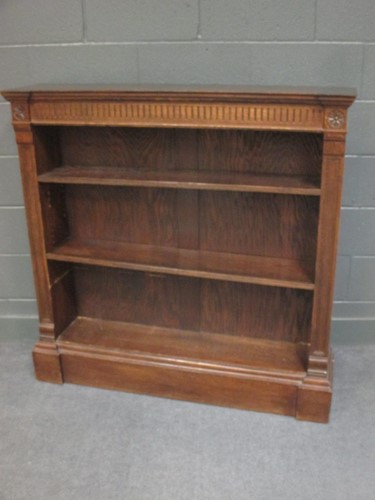 Lot 507 - A late Victorian break front oak open bookcase...
