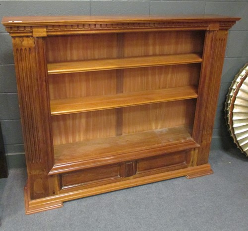 Lot 524 - A 20th century teak open bookcase with...