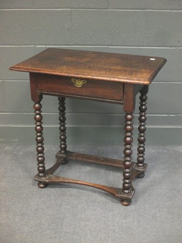 Lot 511 - An 18th century and later oak side table with...