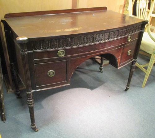 Lot 523 - An early 19th century mahogany bowfront...