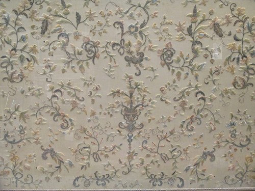 Lot 528 - A large silk embroidered foliate panel, circa...