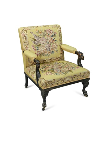 Lot 536 - An 18th century style ebonised open arm library armchair, circa 1900