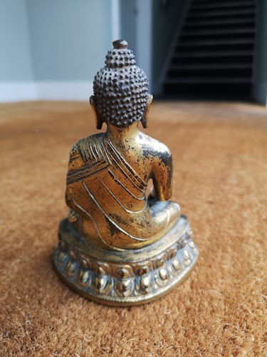 Lot 187 - A 19th century Tibetan gilt bronze model of Buddha