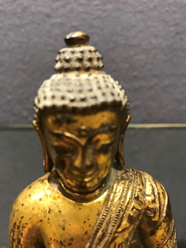 Lot 187 - A 19th century Tibetan gilt bronze model of Buddha
