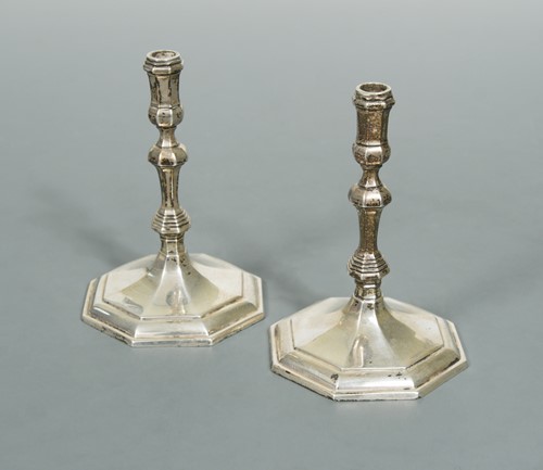 Lot 618 - A pair of 20th Century cast silver taper sticks
