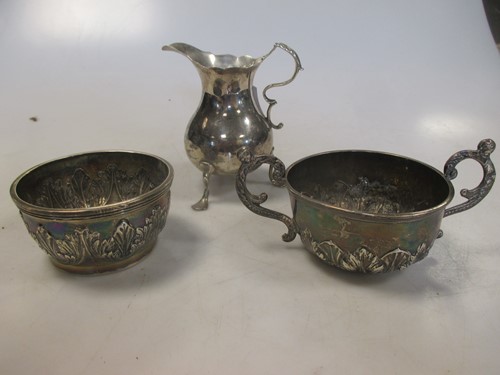 Lot 239 - A George III silver cream jug and two bowls (3)