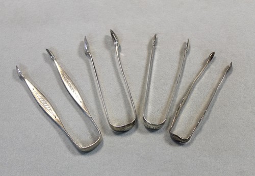 Lot 506 - Four pairs of George III / George IV silver sugar nips