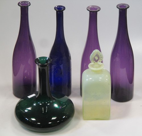 Lot 35 - Three amethyst glass carafes, another blue...