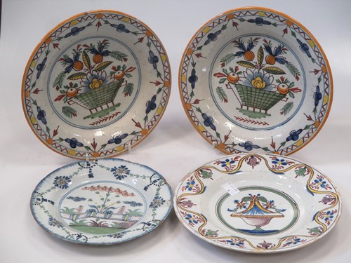 Lot 13 - A pair of Continental tin glazed dishes and...
