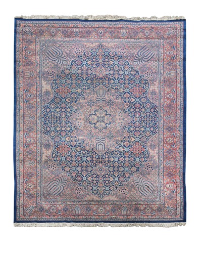 Lot 534 - A Persian design blue ground carpet