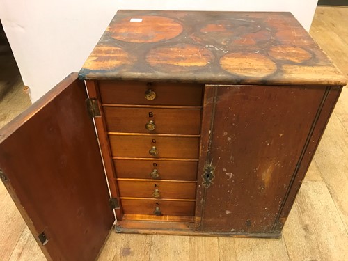 Lot 54 - A cabinet of watchmaker's spare parts, watch...