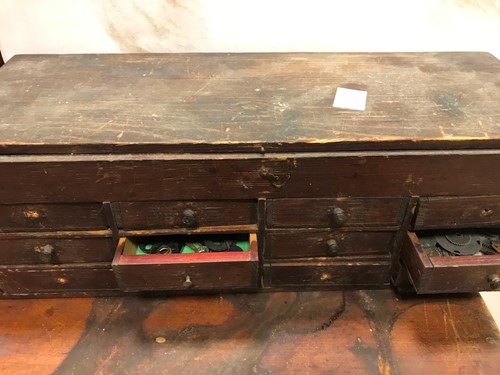 Lot 54 - A cabinet of watchmaker's spare parts, watch...