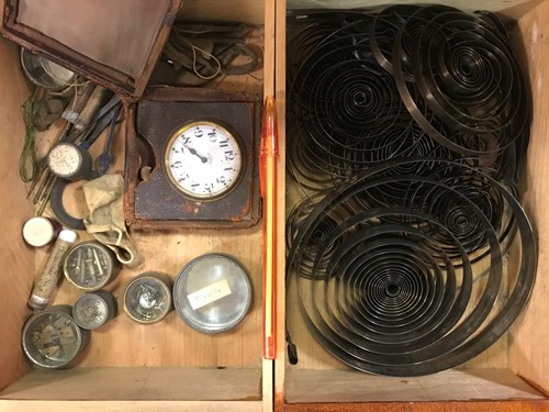 Lot 54 - A cabinet of watchmaker's spare parts, watch...