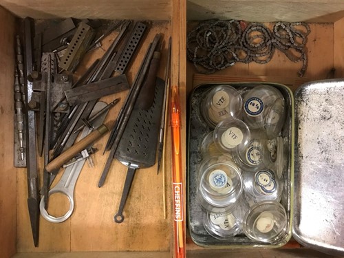 Lot 54 - A cabinet of watchmaker's spare parts, watch...