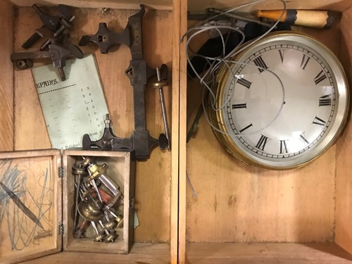 Lot 54 - A cabinet of watchmaker's spare parts, watch...