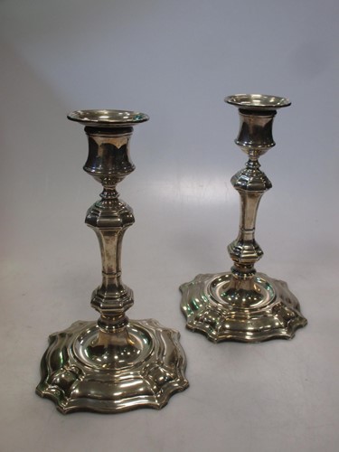 Lot 183 - A pair of silver candlesticks, loaded