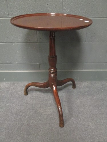 Lot 513 - A mahogany circular tip top table on tripod...