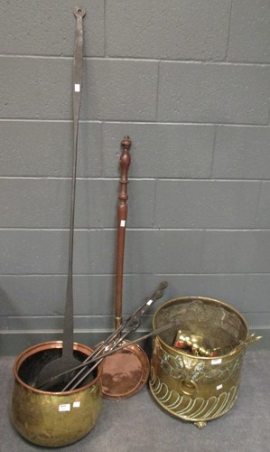 Lot 516 - A copper log basket, warming pan, fire-irons,...