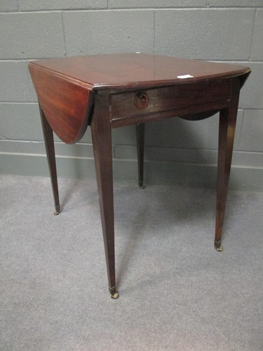 Lot 515 - A George III mahogany oval pembroke table, 88...