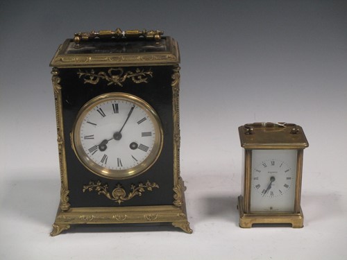 Lot 11 - A French late 19th century ebonised and gilt metal mantel clock